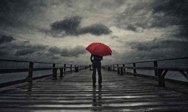 Red umbrella in storm